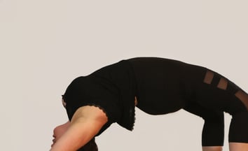 rachel back bend black outfit white background