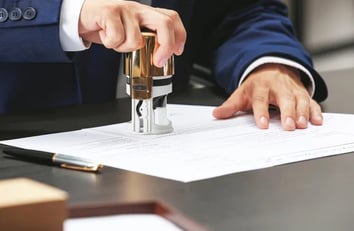 A document is being notarized and stamped for adoption for an adoption by a Notary