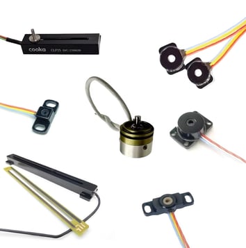 a collection of electronic components including a speaker and wires