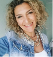 a woman with blonde hair and a blue jean jean jacket
