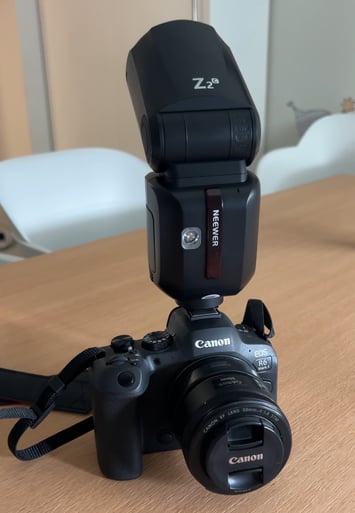 a camera flasher on a table with a flasher