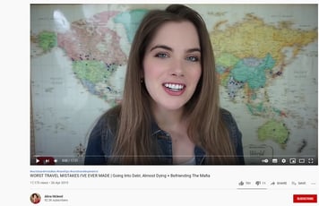 a woman with a smile on her face and a map of the world