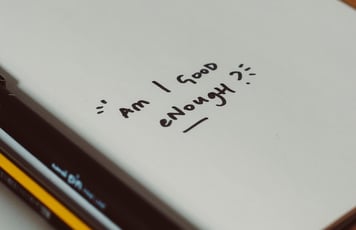 a notebook with a pencil and pencils on it