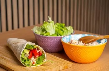 vegetable-wrap-on table-beside-two-bowls