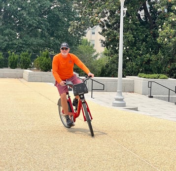 a man riding a bicycle in a park