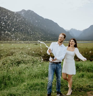 popping champagne pitt lake engagement photoshoot