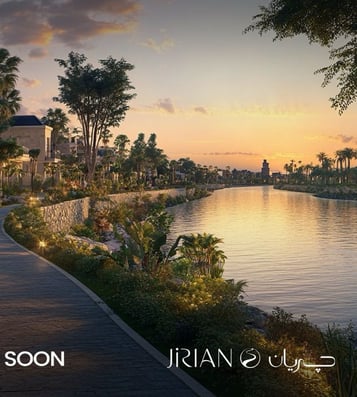 Luxury villas overlooking a waterfront canal at Jirian Compound – sunset view