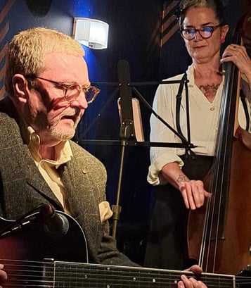 Charlotte Paterson of Celtic Django Project on stage with jazz guitarist Martin Taylor in Edinburgh