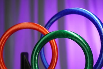 a group of three rings with different colored rings working equitation