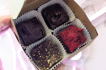a person holding a box of chocolates