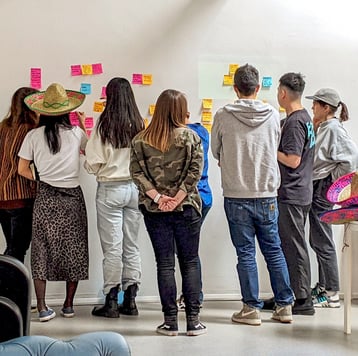 a group of people working together in a behaviour change sprint