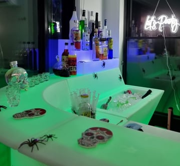 SweetAz Co. corner LED glow bar setup featuring Halloween-themed colours and accessories in Redlands