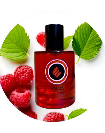 a bottle of valadaa perfume with raspberries and raspberries