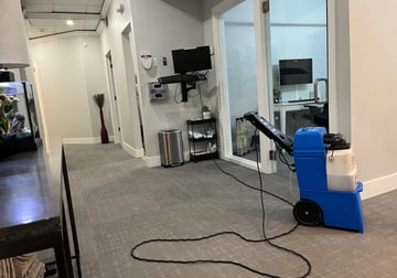 A carpet cleaning machine inside an office building.