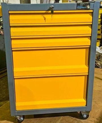 A yellow tool trolley with 5 drawers