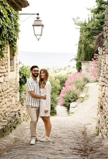 Smiling couple in cobblestone village — South of France wedding photography price