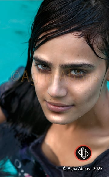 close-up of a beautiful , green eyed, dark hair, sexy young girl in a swimming.  pool, 