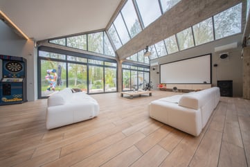 a living room with a large screen tv and a large screen tv
