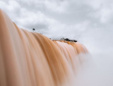 a waterfall with a few trees and a few trees