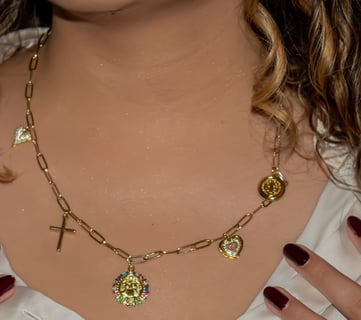 a woman with long hair and a necklace with a heart shaped pendant