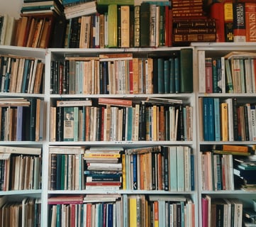 a book shelf full of medical and alternative books and bookshelves