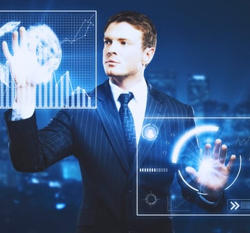 A business leader in a suit adjusts holographic bar charts using both hands on a large glass touchscreen.