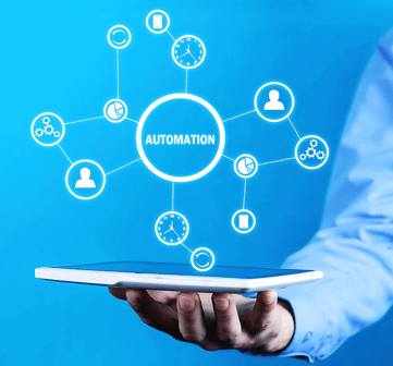 Man in blue shirt holds up a tablet with a holographic mind map centred on "Automation" emerging from the screen, face unseen