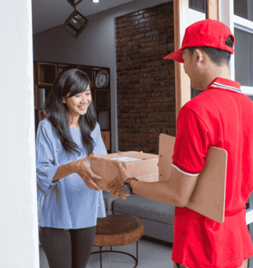 a man and woman are delivering pizzas to a customer