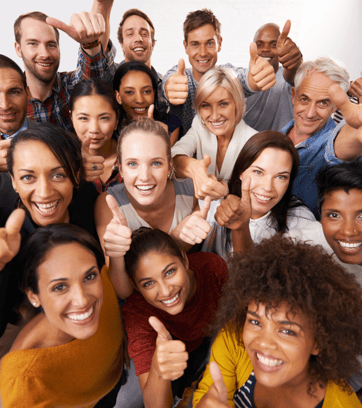 a group of people standing around a group of people with thumbs up