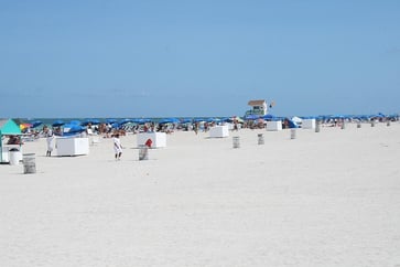 South beach miami florida daytime with umbrellas and a lifeguard tower