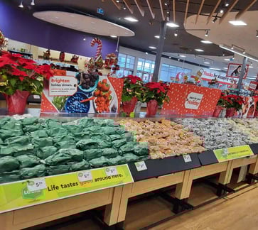 poplar bluff organics and carrots by cam display in local grocery store calgary