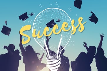 Light bulb and graduating students depicting success and enlightenment. Soft skills.  