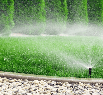 a sprinkler sprinkler sprinkles in the grass