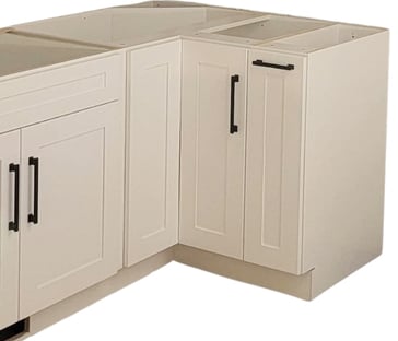 a kitchen with a lazy Susan white shaker cabinet
