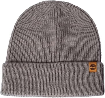 a grey hat with a leather label on the front of a grey beanie