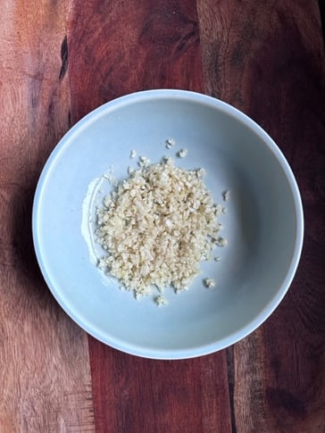 About 8-10 cloves of mined garlic