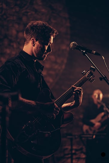 a man playing guitar