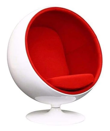 a white ball chair with a red cushion