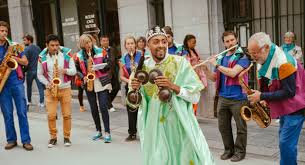 Gnawa Karkabah player with modern band