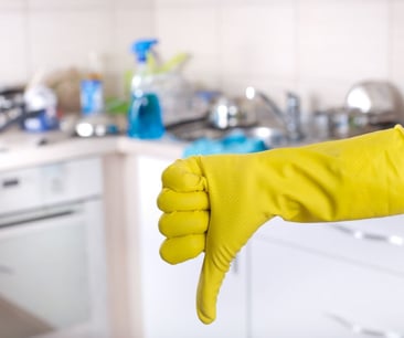 a person wearing yellow gloves and gloves holding a yellow glove