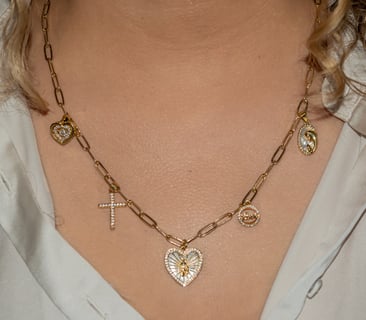 a woman wearing a necklace with a cross on it