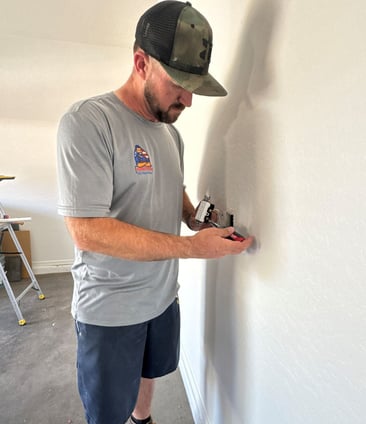 Handyman Replacing Electrical Outlet