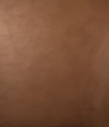 A close up of a incense stick with smoke coming out of it