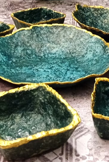 a bunch of blue green bowls with gold and glazing layer, vibrant colorsgreen and gold