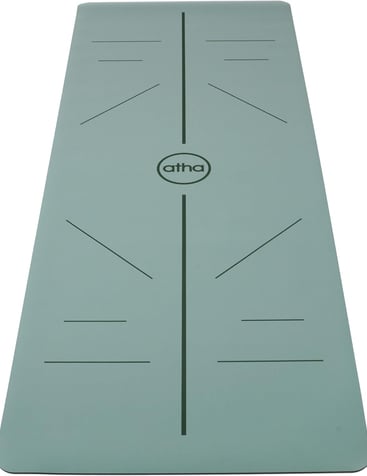 a yoga mat with a green mat and a white background