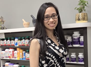 Woman with long black hair with glasses