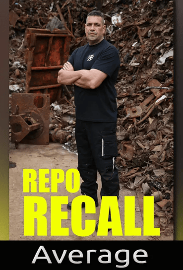 A man standing in front of scrap metal 