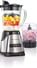 a blender with fruit in a blender