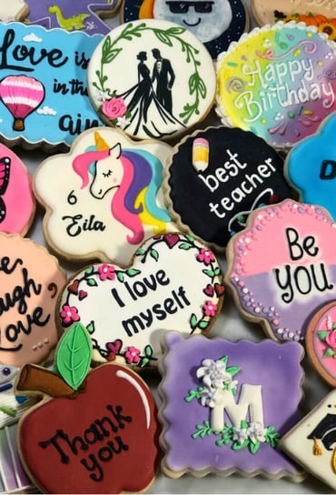 Beautifully decorated cookies with royal icing designs for various occasions custom-made for birthdays, weddings, baby shower