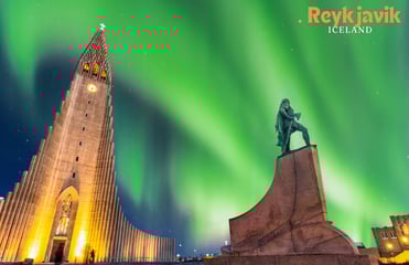 a statue of a man on a pedestal with a green light